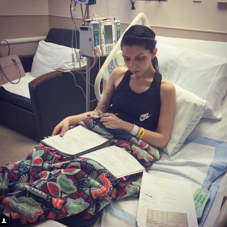 Woman with Chiari Malformation sits in hospital bed studying to be a doctor
