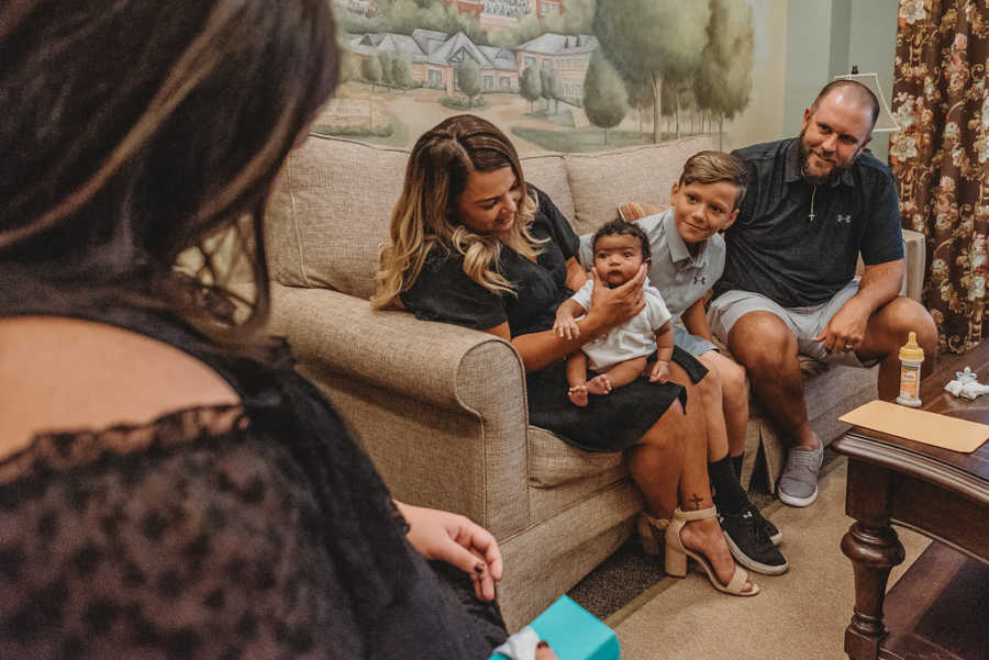 Family take candid photo with foster son