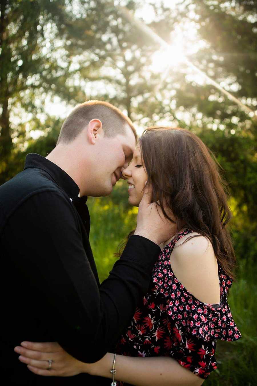 Son of woman with breast cancer leans in to kiss fiancee