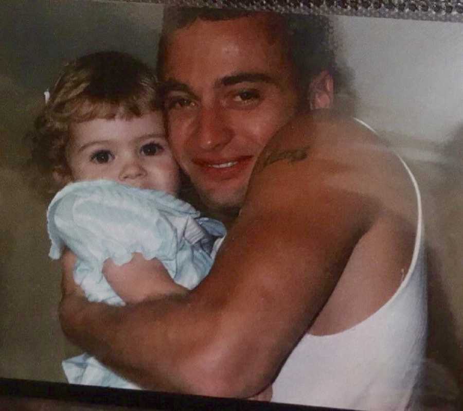 Father who committed suicide stands smiling holding baby daughter