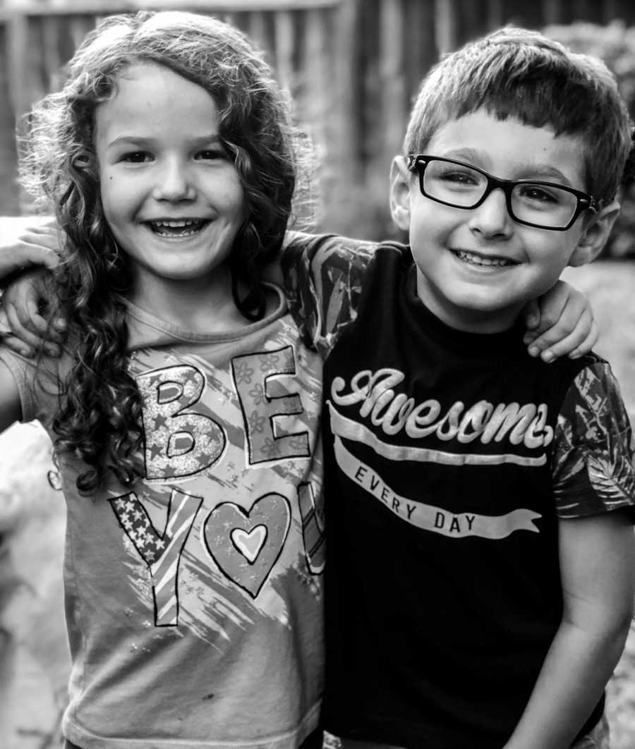 Little girl and adopted brother who are best friends but can fight a lot smile arm in arm