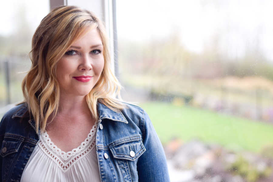 Woman who was closet drunk smiling near window