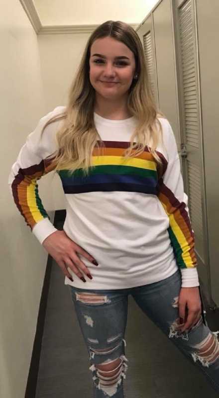 Teen wearing rainbow shirt who is told by her mother that she would've worn that when she was younger