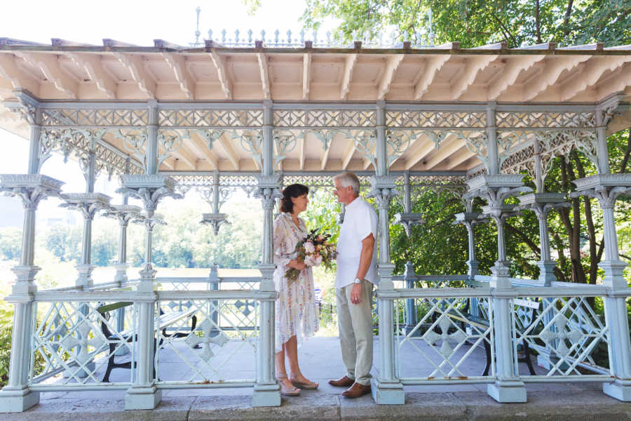 Husband and wife who lost her memory after car accident stand under gazebo at vow renewal