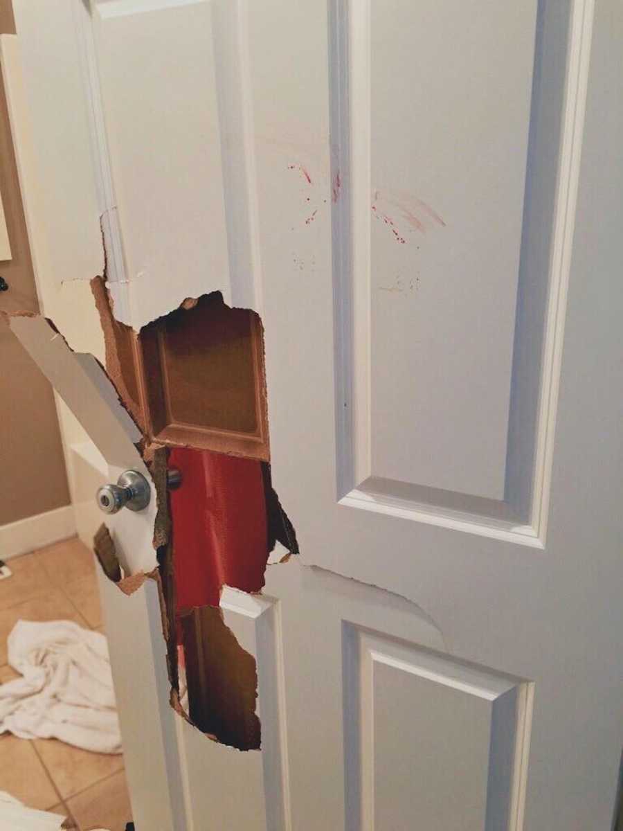 Door with hole in it from violent husband