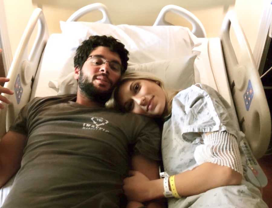 Woman re-diagnosed withSuperior Mesenteric Artery Syndrome lies in hospital bed with husband