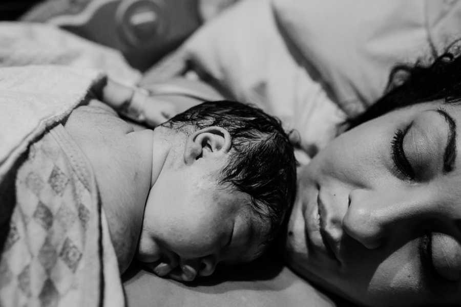 Newborn laying on mother's chest who struggled to have him