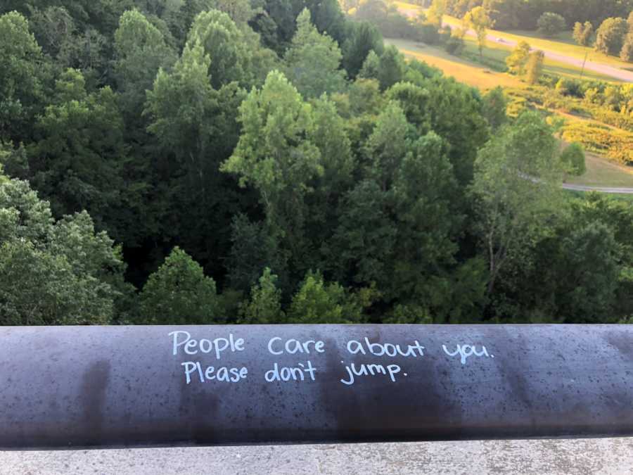 Ledge that says, "people care about you. please don't jump"