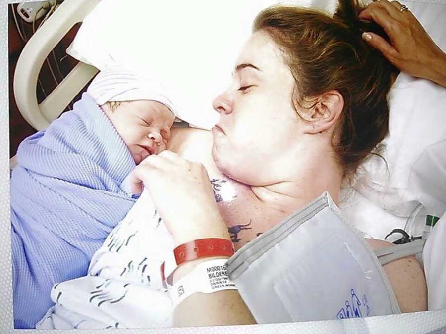 Woman lying in hospital bed with her newborn who will one day lose custody of him
