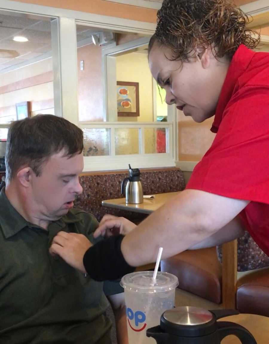 IHOP waitress places Captain American pin on 50 year old man with down syndrome