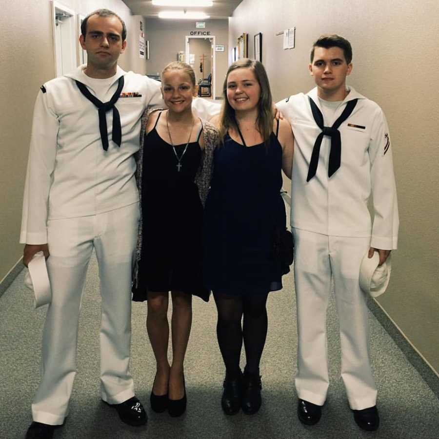 Widowed mother's naval son standing with two girls and another naval officer