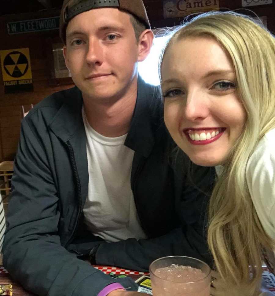 Brother and sister take a selfie while out to eat together