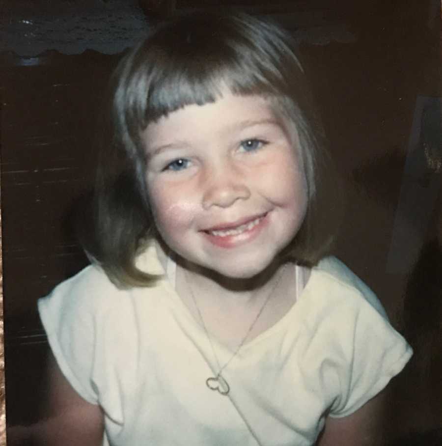 Woman who became closet drunk as an adult smiling as a little girl