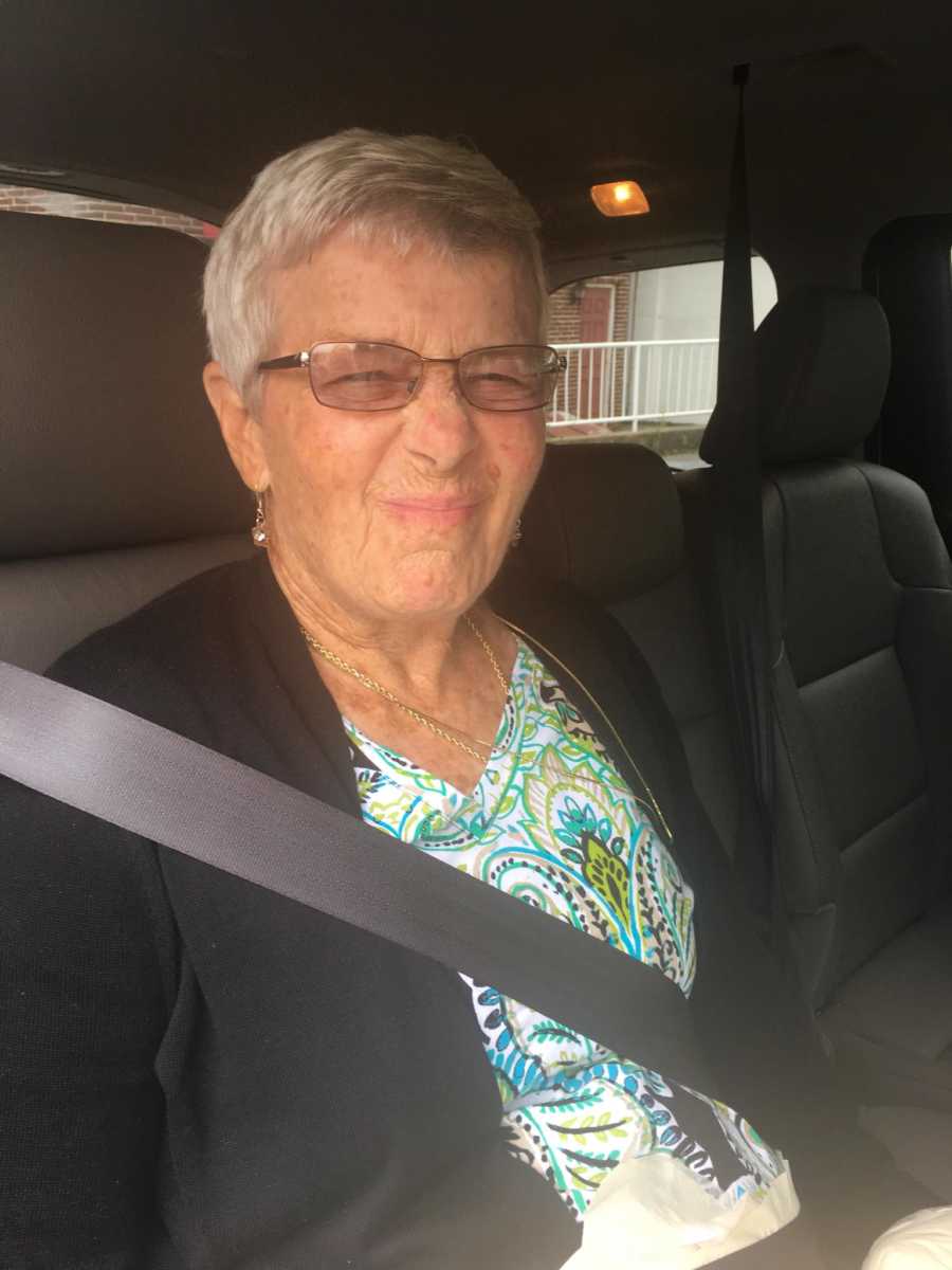 Woman with dementia sits in car scrunching her face who husband has hard time dealing with her alone