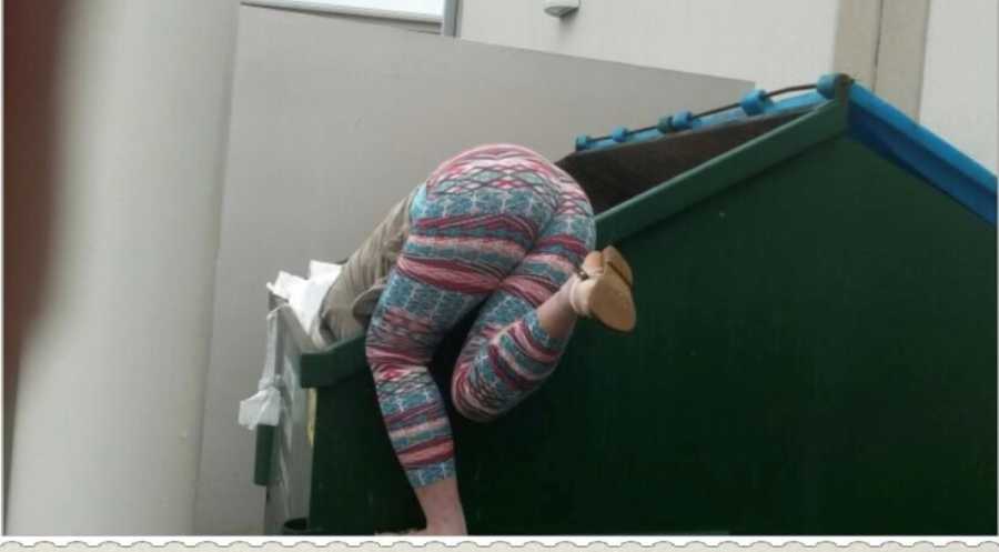 Junkie dumpster diving to see if she could find any drugs