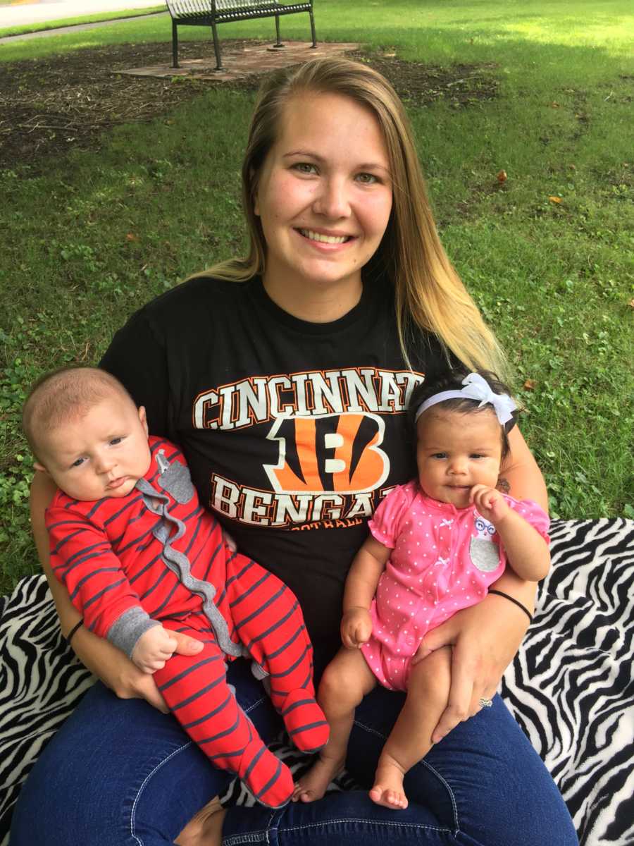 Woman who donates breastmilk to another mother sits holding her daughter and baby who receives her breastmilk 