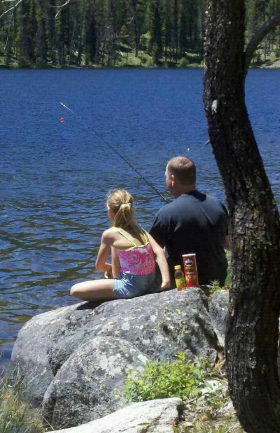 Man who died from pancreatic cancer sits fishing on rock with daughter by his side