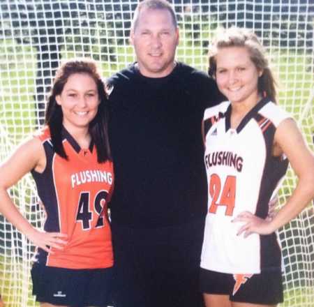 Teen standing in sports uniform beside her father who has since passed and her sister