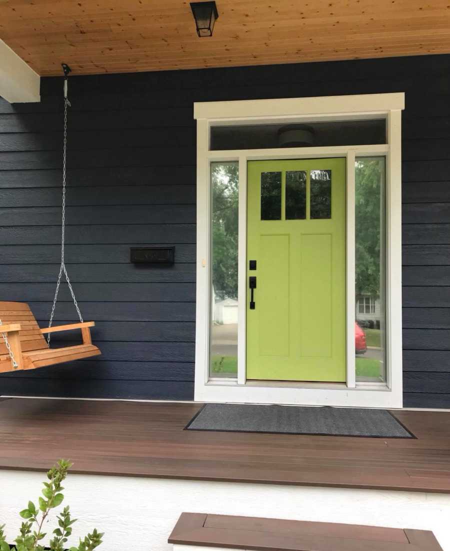 Front porch with lime green door and porch swing where son who passed away would've stood