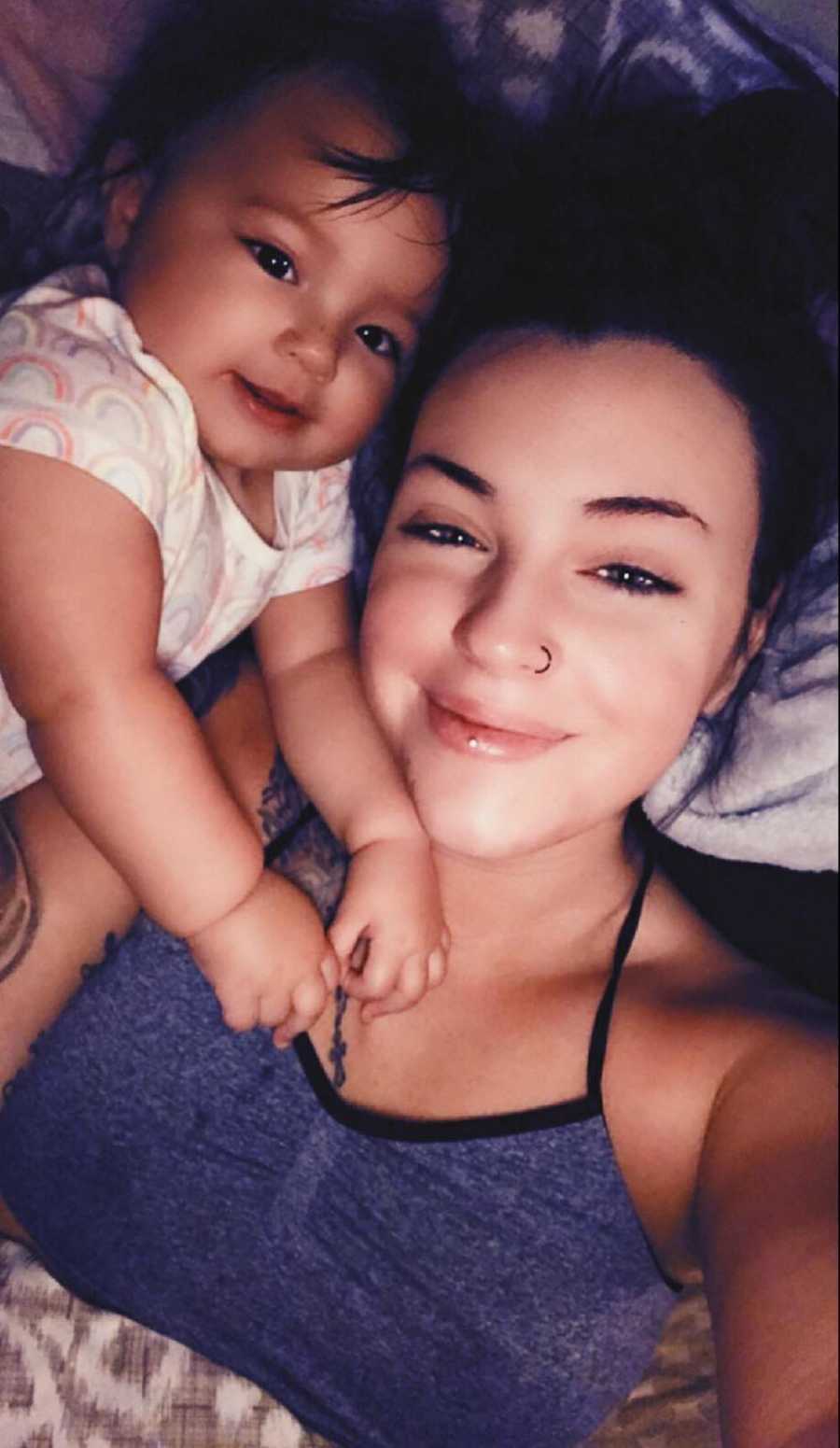 Woman who was raped smiles in selfie with infant daughter