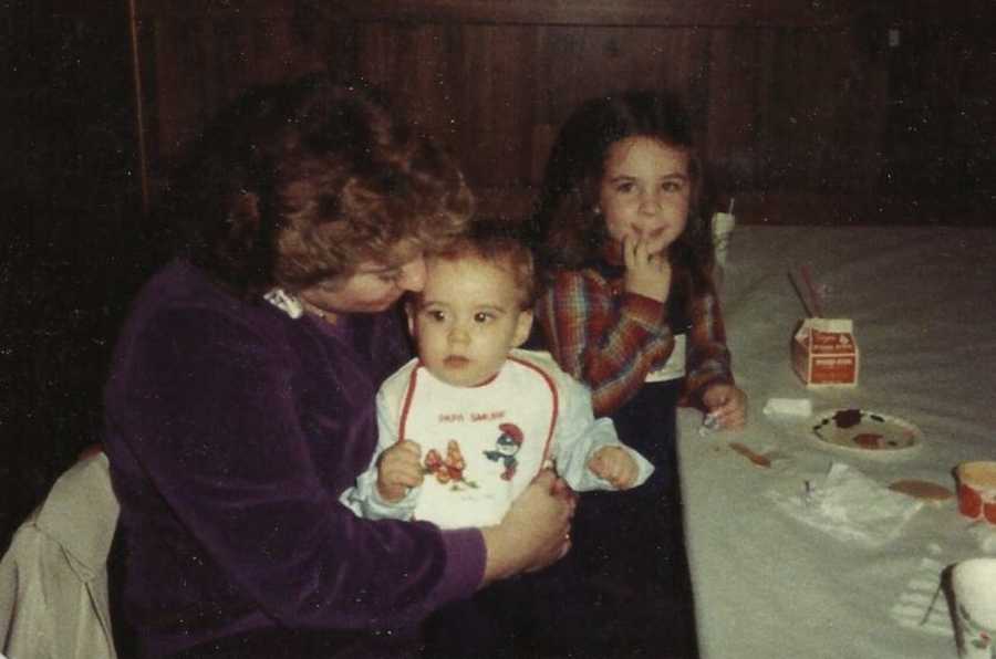 Woman who lost weight her way as a little girl sitting at dinner table with mother and sibling