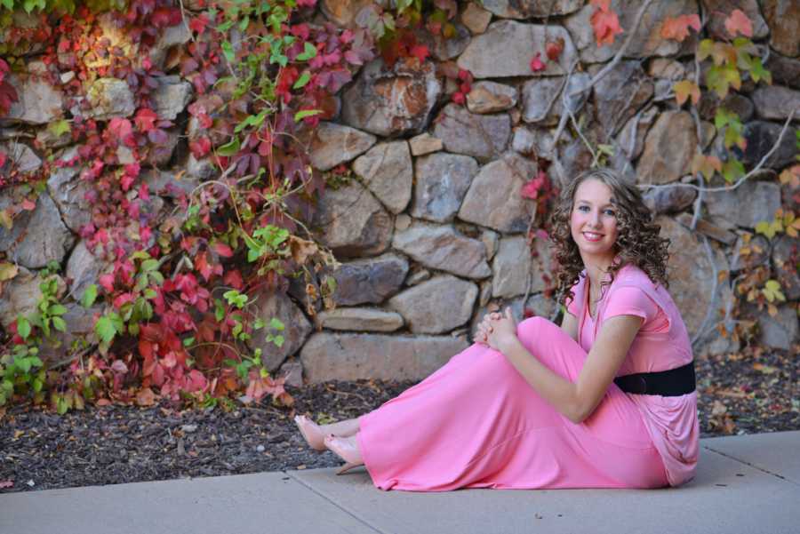 Teenager who was told she didn't have anything going for her sits on sidewalk in pink dress and heels