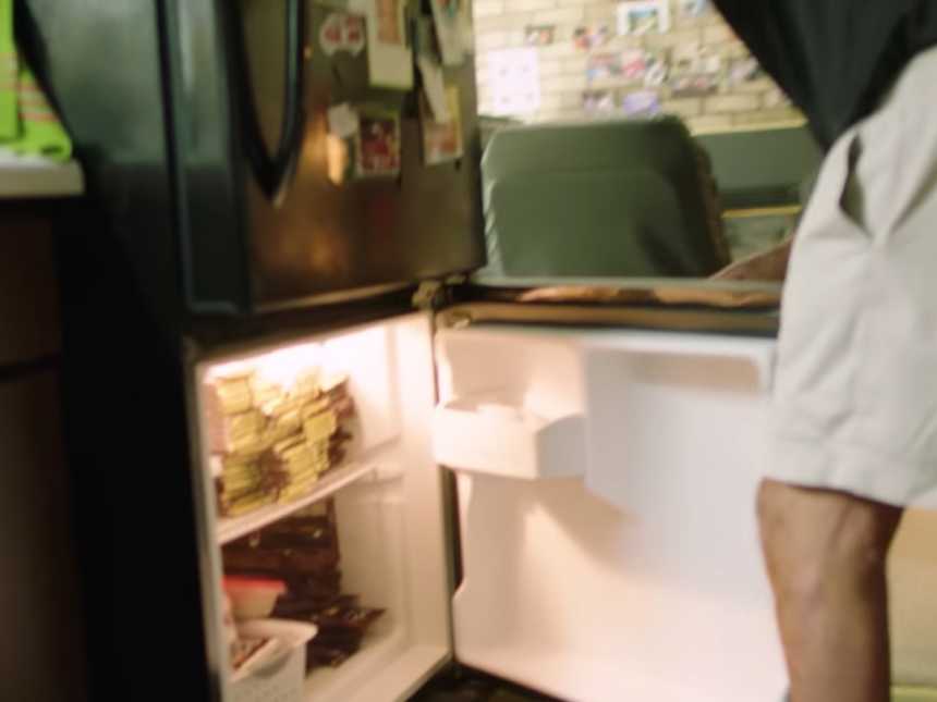 WWII veteran's fridge that has stacks of chocolate bars that he hands out to people