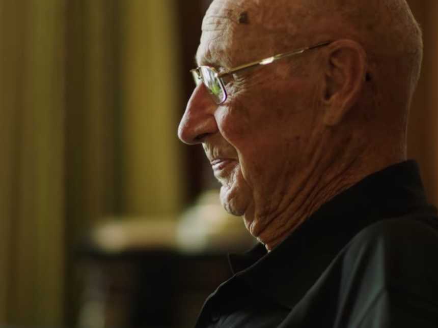 Side profile of 93 year old WWII veteran who hands out chocolate bars to people