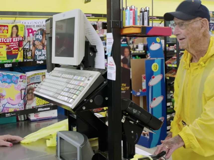 WWII veteran purchasing chocolate bars that he will hand out to people