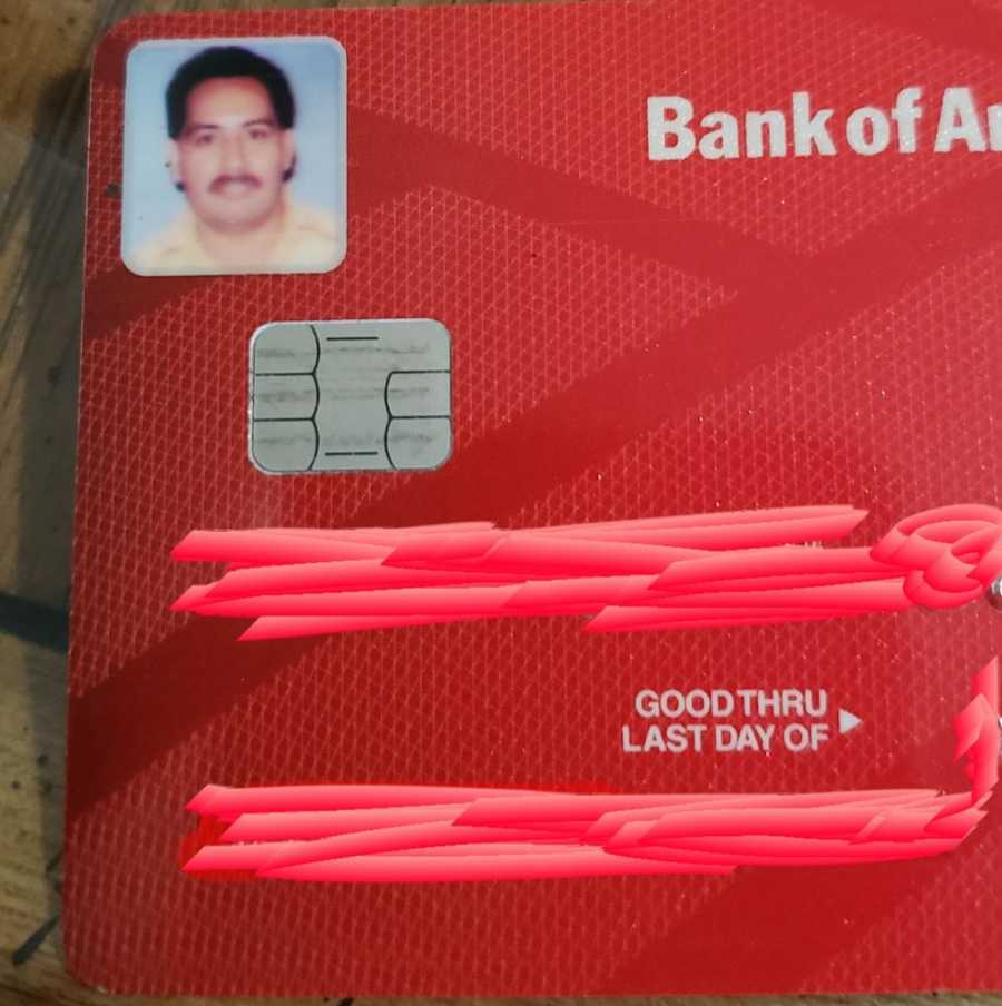 Red Bank of America credit card with owner's picture in top left corner