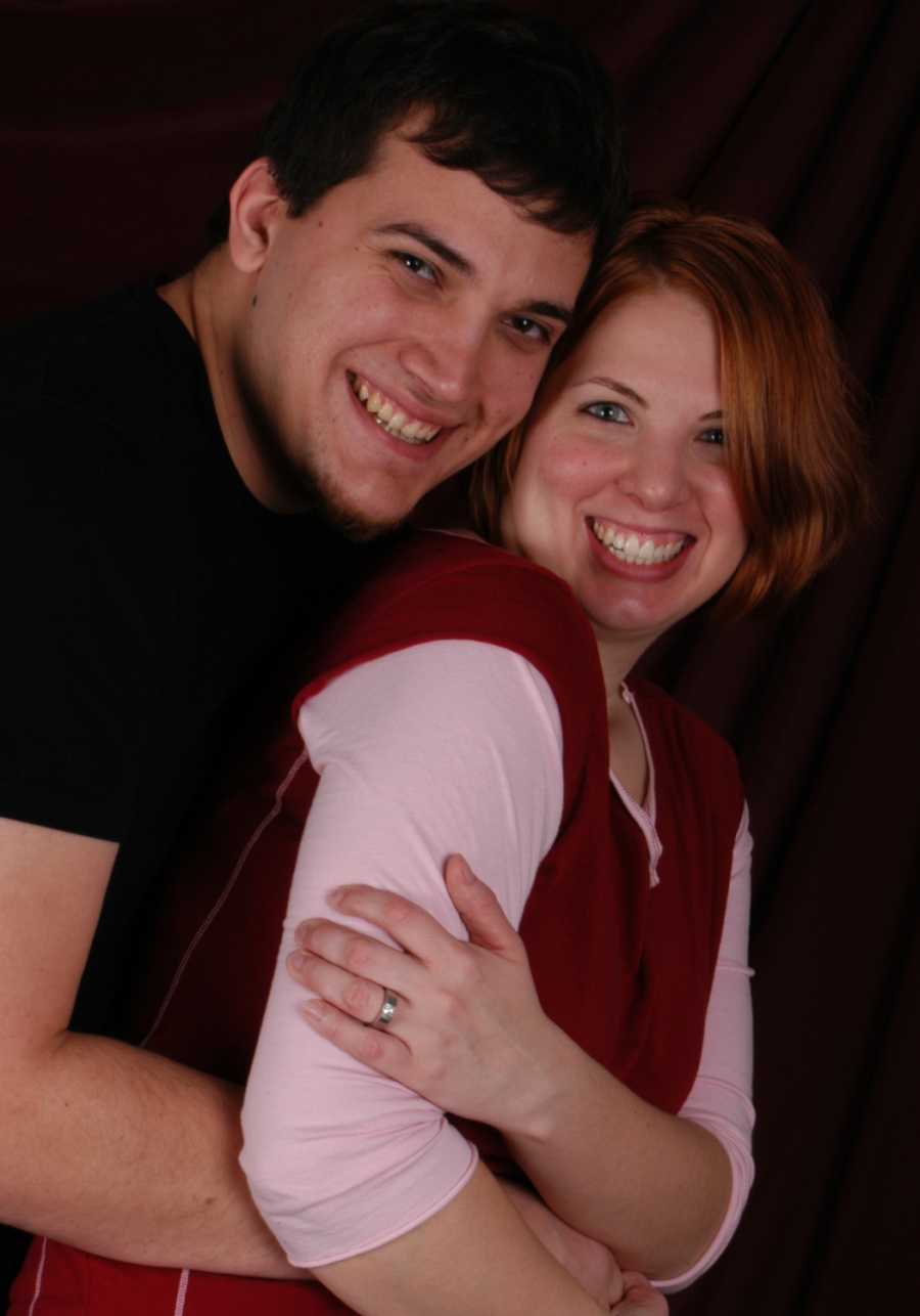 Engaged couple smiles in photoshoot