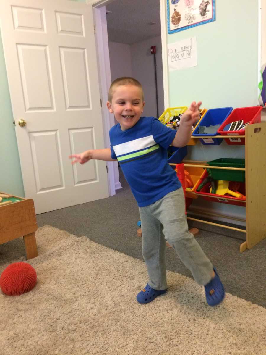 Little boy whose mother is always asked if he will ever speak dances in toy room at home