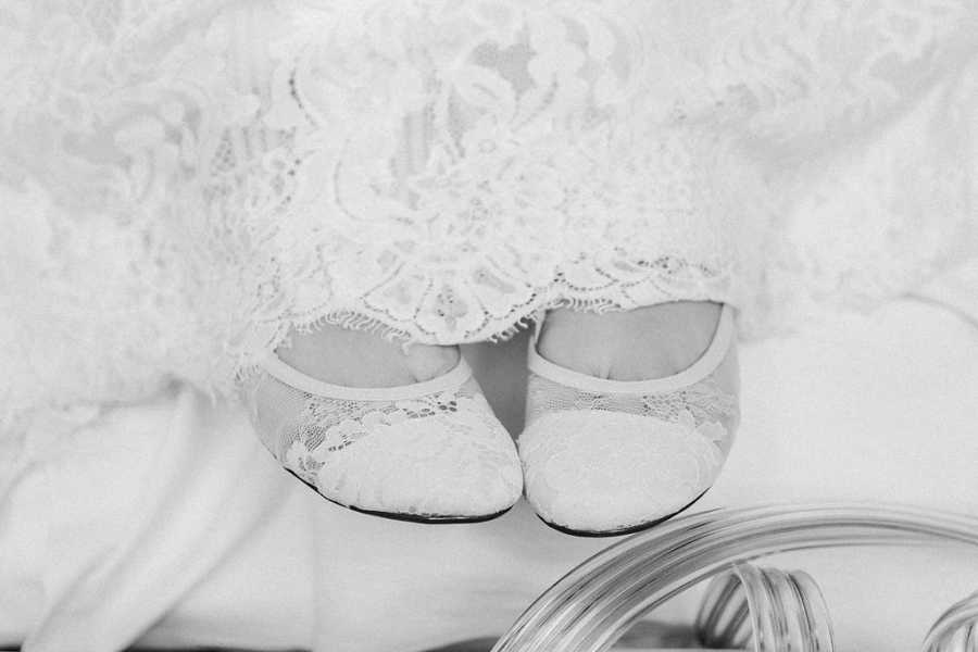 Close up of teen with cancer's lace ballet flats she is wearing for her wedding
