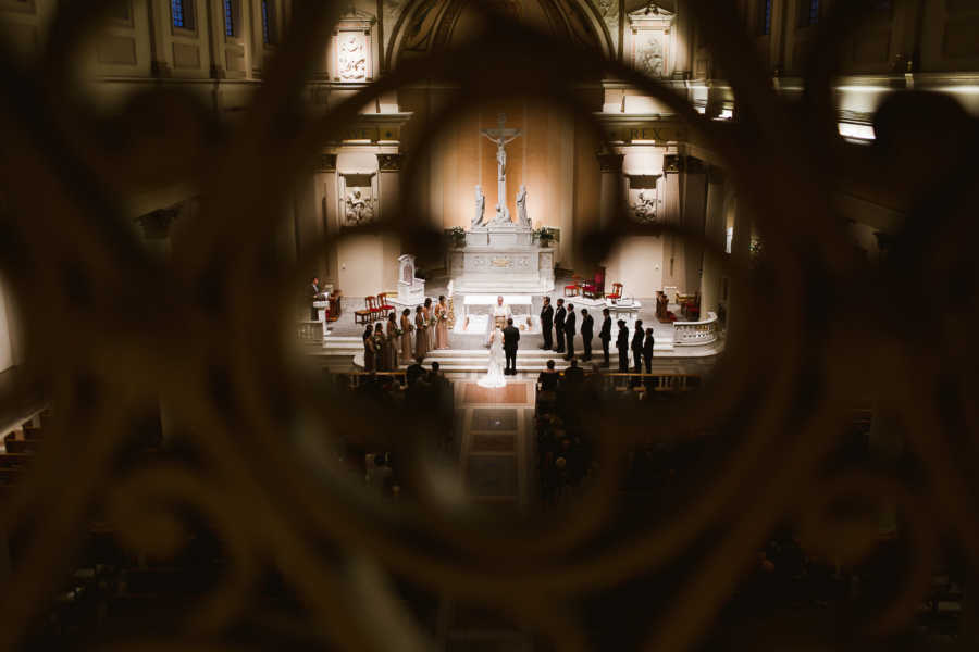 View from far away of wedding in church where bride's grandparents were married