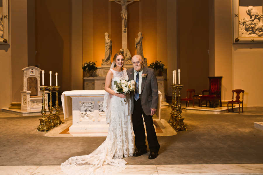 Bride stands with grandfather in church where he married his wife