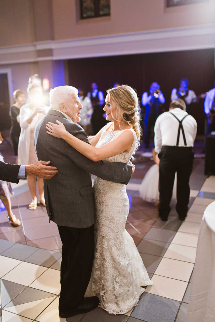 Bride dances with grandfather at her wedding reception