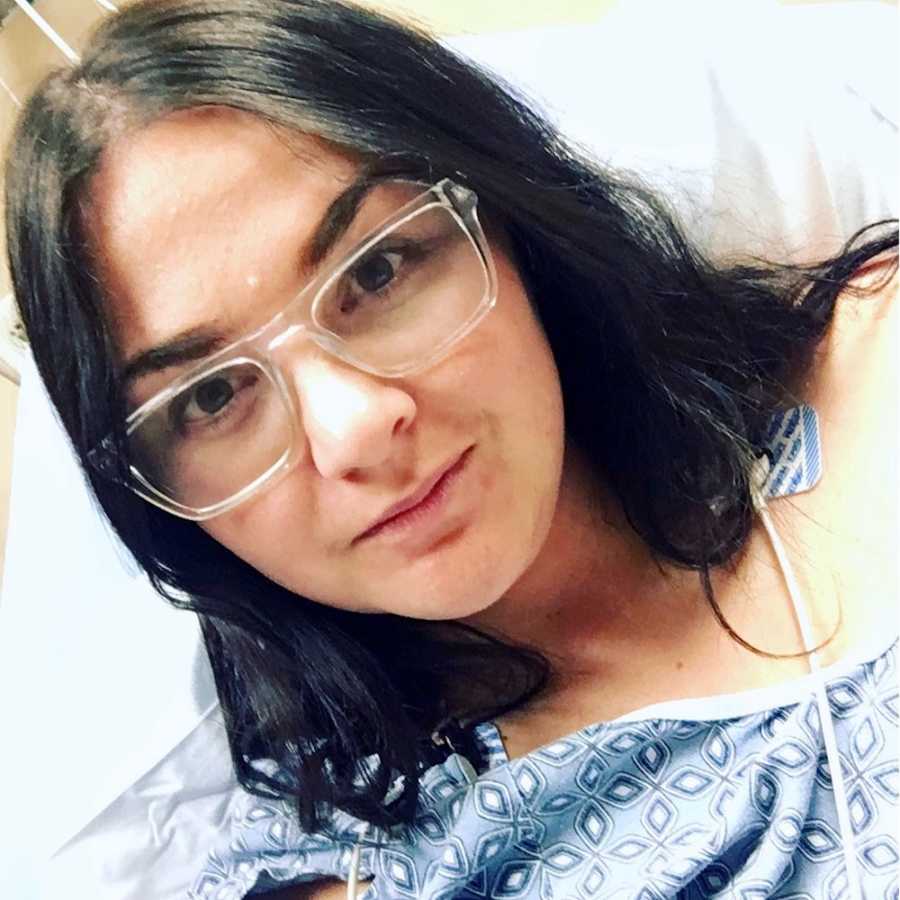 Woman with Leibman Sacks endocarditis grins in selfie while in hospital bed
