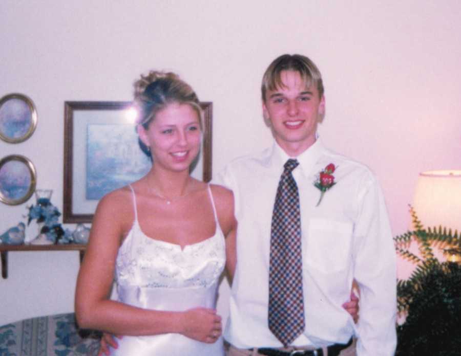 Husband and wife who has since passed smiling when they were younger dressed for school dance