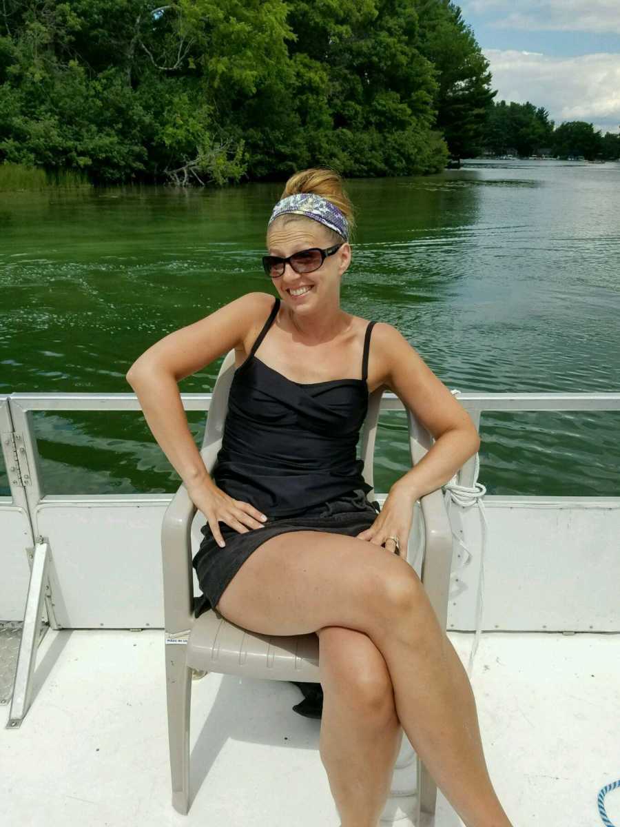 Wife who has since passed from Cardiac Sarcoidosis sitting on plastic chair on pontoon boar