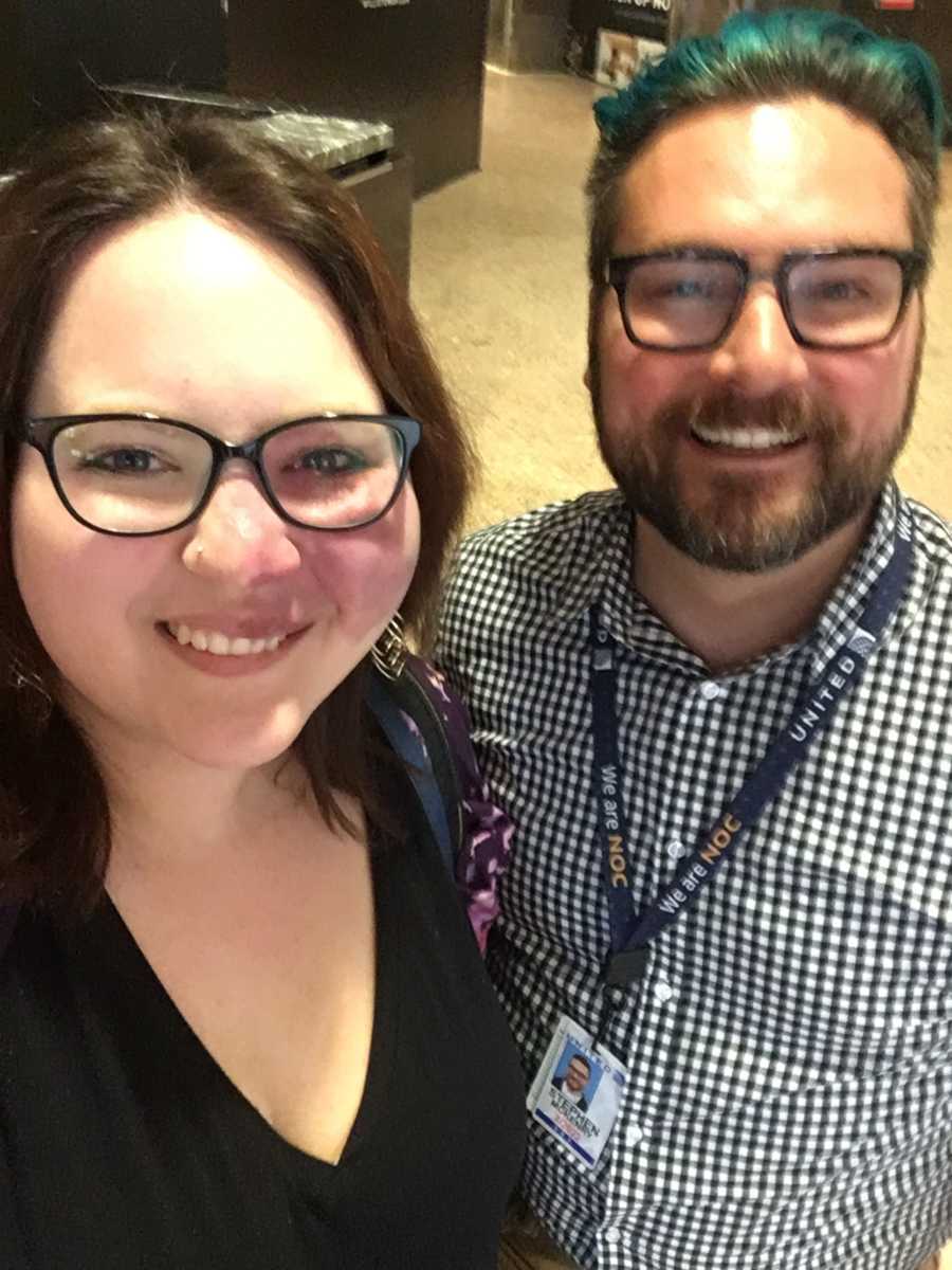 Woman smiles with United airlines employee smiling in selfie