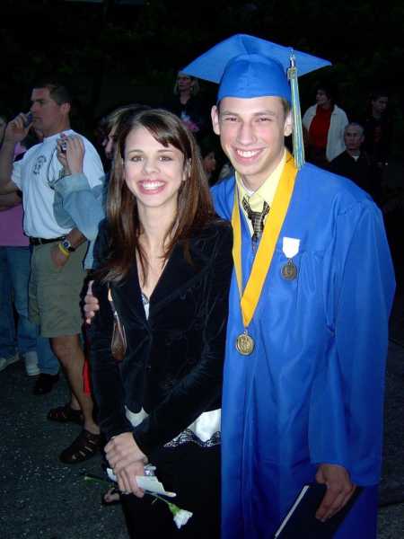 Man who passed away from bone marrow disease in cap and gown beside wife