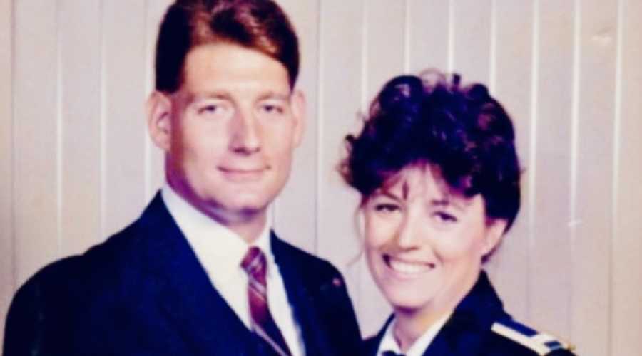 Wife smiling beside husband who survived 9/11 attacks