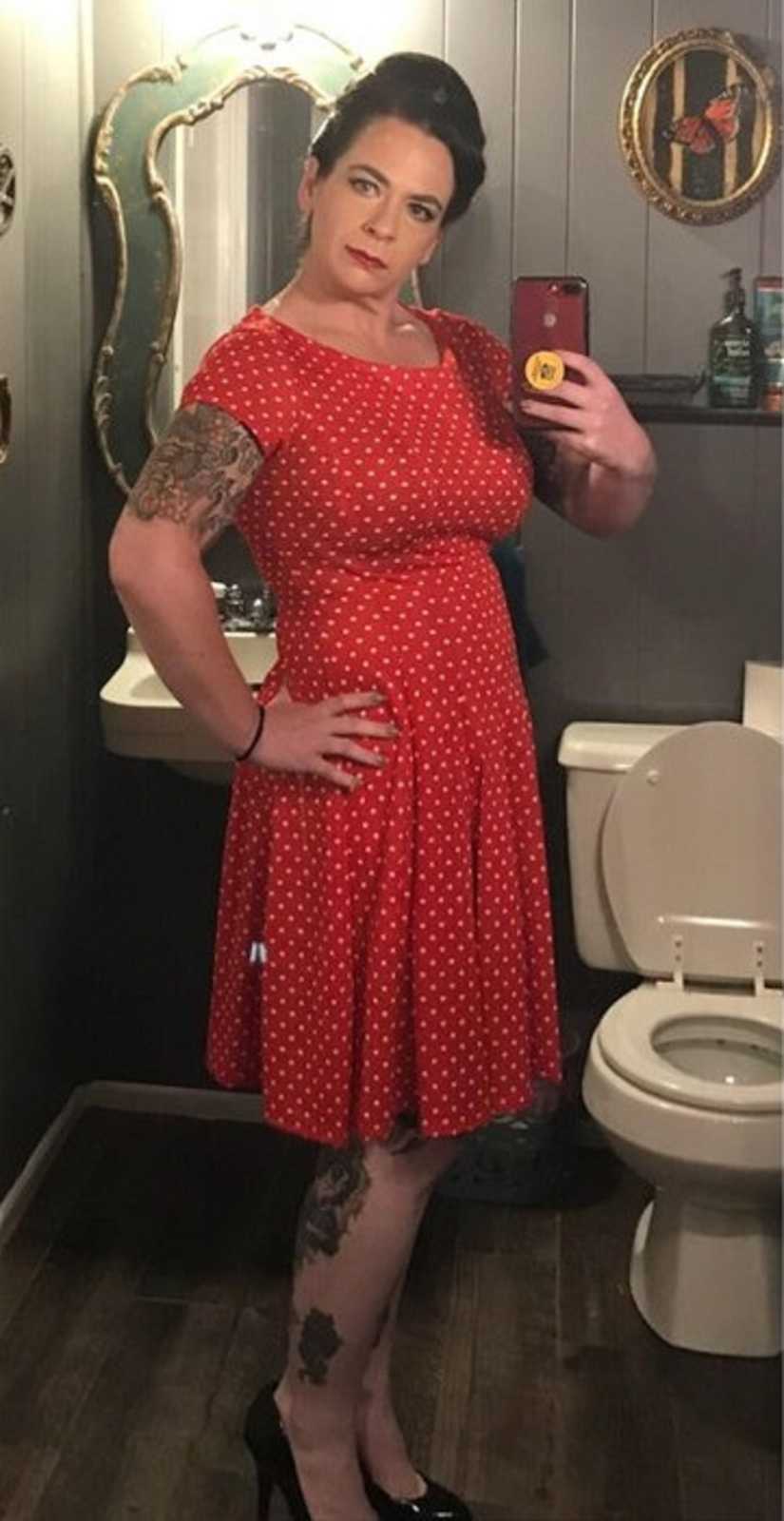 Mother who was once ashamed of her body takes mirror selfie in red dress in bathroom