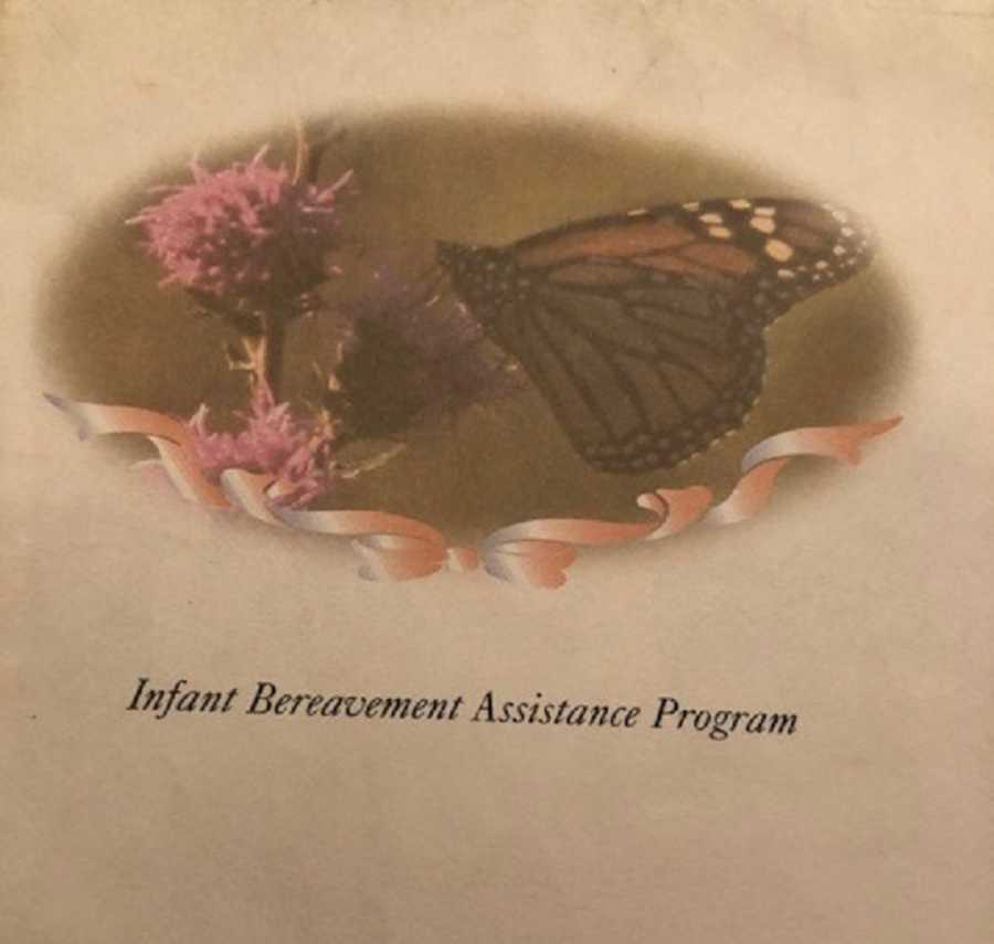 Cover of program with butterfly on flower that says, "Infant bereavement assistance program"