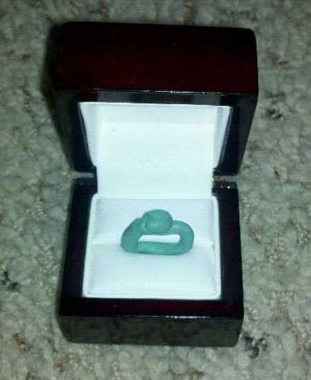 Opened ring box with engagement ring made out of playdough