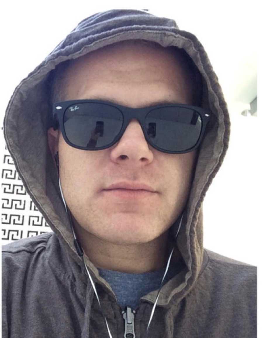 Man who was a junkie takes selfie with hood up and sunglasses on 
