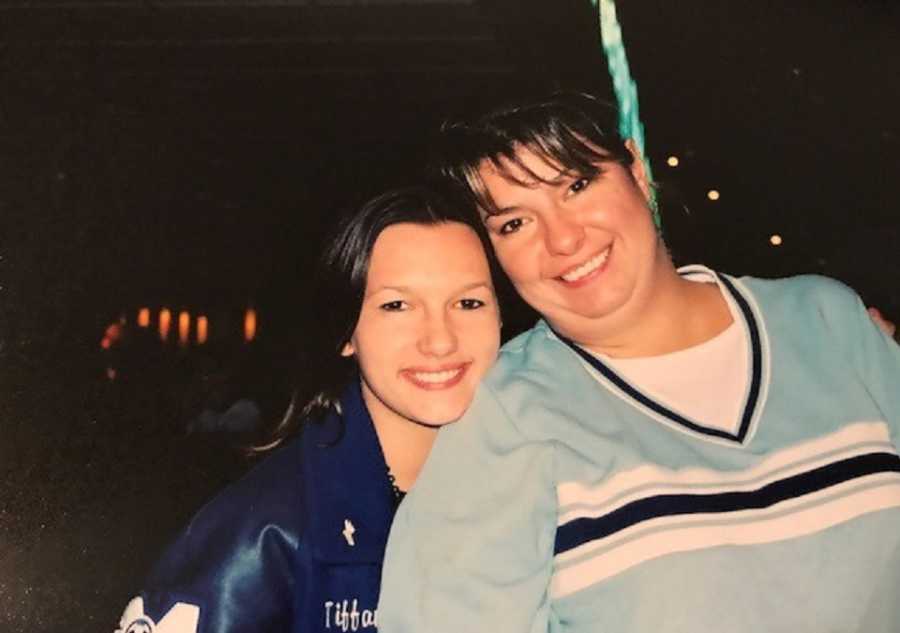 Daughter sits smiling with mother who has Crohn's 