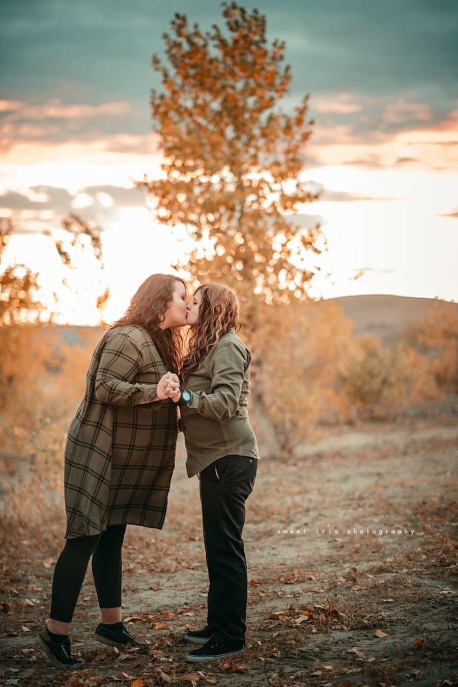 Wifes holds hands and kiss outside 