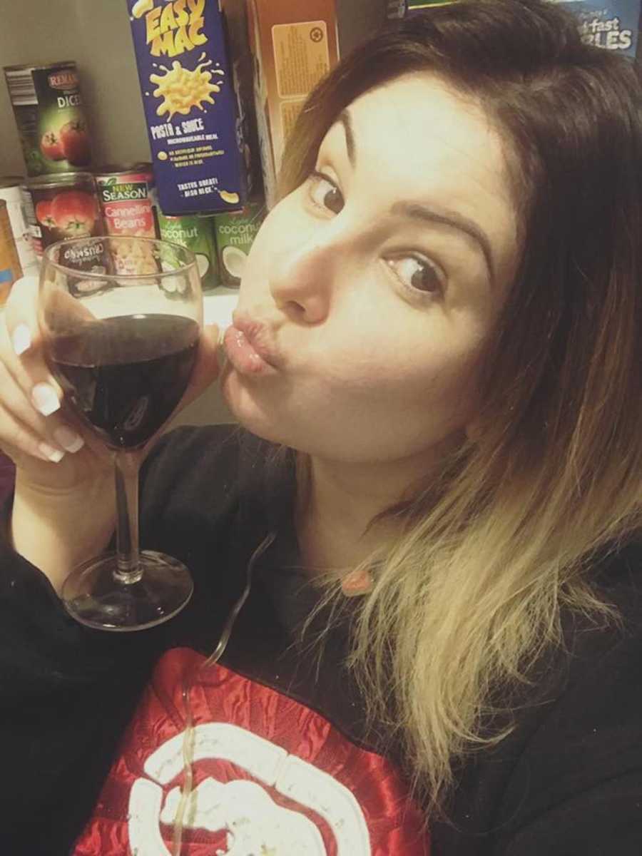 Mother poses is selfie with glass of wine who says that all mother's don't have to get along