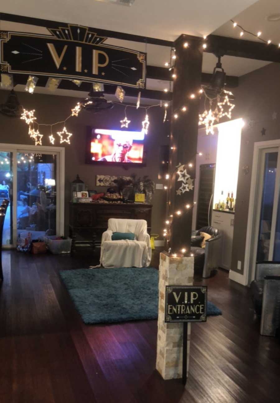 Living room of home turned into Prom setting with sign that says VIP